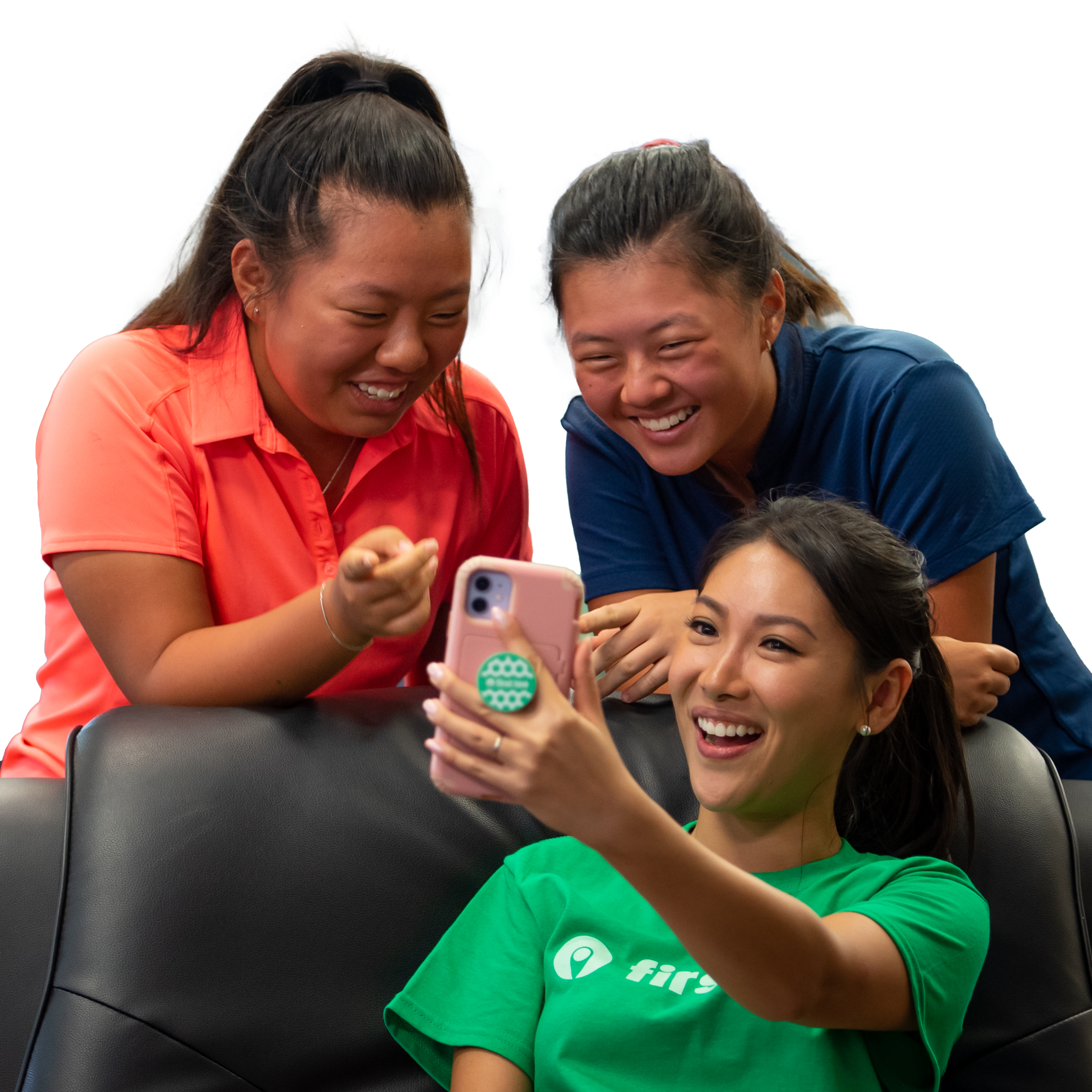 Three female ambassadors looking at at phone